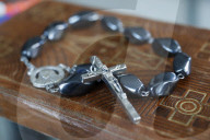 Rosary beads on an old bible. Ho Chi Minh City. Vietnam.