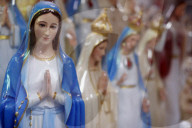 Shop selling religious christian items. Holy Virgin statues. Ho Chi Minh City. Vietnam.