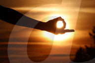 Close-up of a female hand forming a Mudra gesture used in yoga practice and meditation. France.