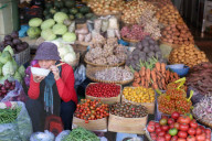 Woman selling fresh vegetables on market. Dalat. Vietnam.