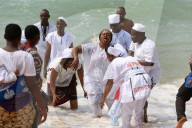 Voodoo cult on a beach in Cotonou, Benin. Tranced woman.