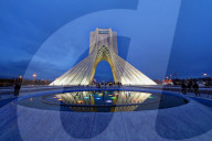 Azadi Tower or Freedom Monument and cultural complex reflecting in a pond at sunset, Tehran, Islamic Republic of Iran