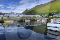 Harbour, hotel and fishing boats, mountains, reflections, Siglufjordur, (Siglufjorour), stunning Summer weather, North Iceland