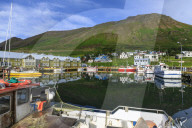 Harbour, hotel and fishing boats, mountains, reflections, Siglufjordur, (Siglufjorour), stunning Summer weather, North Iceland