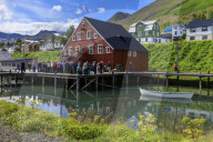 Tourists at the busy, award-winning Herring Era Museum, Siglufjordur, (Siglufjorour), stunning Summer day, North Iceland