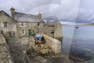 Weather front over the Lodberrie, historic building, home of TV detective Jimmy Perez, Lerwick, Shetland Isles, Scotland, Europe