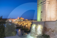 Dusk lights on Puerta del Puente and Calahorra tower (Torre de la Calahorra), gate of Islamic origin, Cordoba, Andalusia, Spain