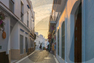 People in the medieval alley of the city center, Conil de la Frontera, Costa de la Luz, Cadiz Province, Andalusia, Spain