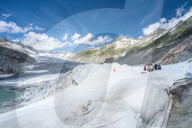 Rhone Glacier covered with white blankets to prevent extreme melting due to climate change, Gletsch, Canton of Valais, Switzerland