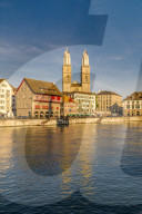 Sunset over Grossmunster Cathedral and Limmatquai street along the banks of Limmat River, Zurich, Switzerland