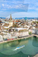 Elevated view of Limmat River and St.Peter church from tall towers of Grossmunster Cathedral, Zurich, Switzerland
