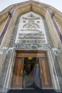 Sufi men standing in the Maruf al-Karkhi sufi mosque, Baghdad, Iraq