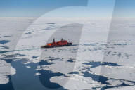 Aerial of the Icebreaker '50 years of victory' on its way to the North Pole breaking through the ice, Arctic