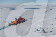 Aerial of the Icebreaker '50 years of victory' on its way to the North Pole breaking through the ice, Arctic