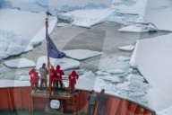 Tourists watching the ice breaking on board of an icebreaker, North Pole, Arctic