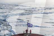 People enjoying the breaking ice on board of an icebreaker, North Pole, Arctic
