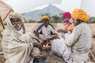 Camel herders early in the morning at the Pushkar Camel fair, Pushkar, Rajasthan, India, Asia,