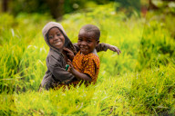Cute kids posing in Lake Bunyonyi, Uganda