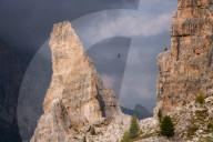 Adventure seeker high wire walking in Cinque Torri, Dolomites, Italy, Europe