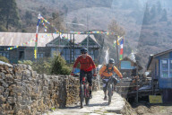 Mountain bikers in the little village of Sing Gompa in the Gosainkund region in the Himalayas