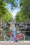 Bicycle on a bridge, Leidsegracht canal, Amsterdam, Netherlands