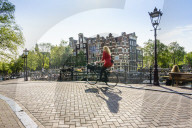 Cyclists on a bridge over Brouwersgracht, Amsterdam, Netherlands