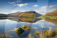 Skiddaw reflected in Tewet Tarn, Keswick, Cumbria, UK