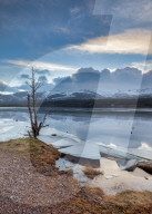 Ice sheets in severe winter weather on Loch Morlich, at daybreak.