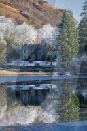 Partially frozen Loch Ard and a hoar frost around Aberfoyle, The Trossachs, Scotland, UK.