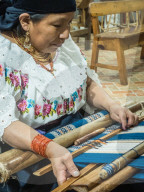 Indigenous woman weaving with backstrap loom, Otavalo, Ecuador, South America