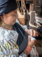 Indiginous woman doing traditional embrodery, Otavalo, Ecuador, South America