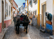 Horse-drawn carriage within the ancient fortified village of Obidos, Oeste Leiria District, Portugal, Europe