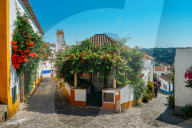 Narrow quaint streets within the ancient fortified village of Obidos, Oeste Leiria District, Portugal, Europe