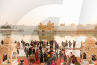December 2018 - Sunset at The Golden Temple in Amritsar, India. Crowds gather to prey and watch the sunset.