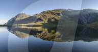 Tryfan reflected in the water of Llyn Idwal in Snowdonia.