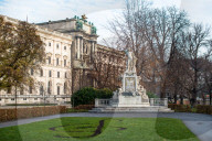 Mozart statue in Burggarten in front of Neue Burg building, part of the Hofburg palace, Vienna, Austria.
