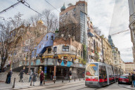 Tram at Hundertwasserhaus, expressionist landmark and public housing, designed by Friedenreich Hundertwasser in Vienna. Austria.