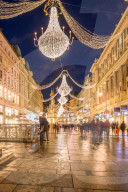 Christmas illuminations after dark on Vienna's city centre thoroughfare the Graben. Austria.