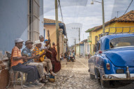 Elderly Cubans playing music on the street, American classic car, Trinidad, Sancti Spiritus Province, Cuba, Central America