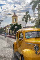 Yellow vintage taxi in Trinidad, UNESCO World Heritage Site,Trinidad, Cuba, West Indies, Caribbean, Central America