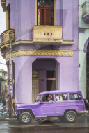 Pink building and pink vintage car in La Habana, Havana, Cuba, West Indies, Caribbean, Central America