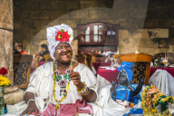 Cuban woman posing for photos while smoking big cuban cigar in La Habana, Havana, Cuba, West Indies, Caribbean, Central America