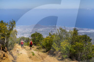 hijers walking down the Las ventanas de Guimar (thousand windows hike) at Tenerife, Canary Islands, Spain, Europe,