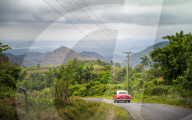 Old vintage American car on a road outside Trinidad, Sancti Spiritus Province, Cuba, West Indies, Caribbean, Central America