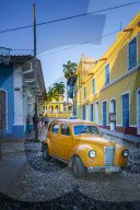 Yellow taxi in Trinidad, UNESCO World Heritage Site, Sancti Spiritus, Cuba, West Indies, Central America