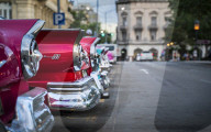 Colourful old American taxi cars parked in Havana at dusk, UNESCO, La Habana, Cuba, West Indies, Caribbean