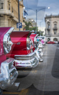 Colourful old American taxi cars parked in Havana at dusk, UNESCO, La Habana, Cuba, West Indies, Caribbean
