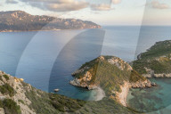 Elevated view from a lookout over the Porto Timoni Double Bay at sunset, Afionas, Corfu, Greece, Europe