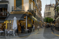 Narrow street in the historical centre at dusk, Seville, Andalusia, Spain, Europe