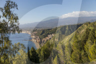 View from the public garden Parco Duca di Cesaro to Giardini Naxos and Mount Etna, Taormina, Sicily, Italy, Europe